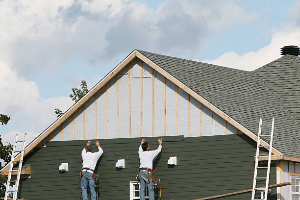 Professional Emergency Siding Repair technician working in Greenvale, NY